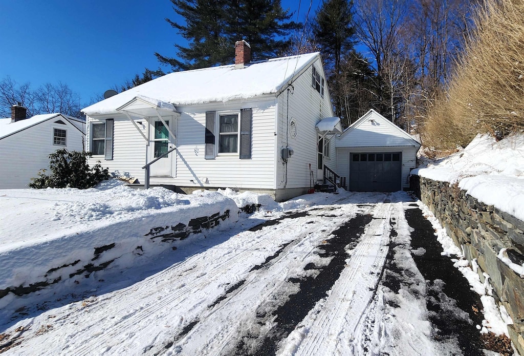 view of front of house featuring an outbuilding and a garage