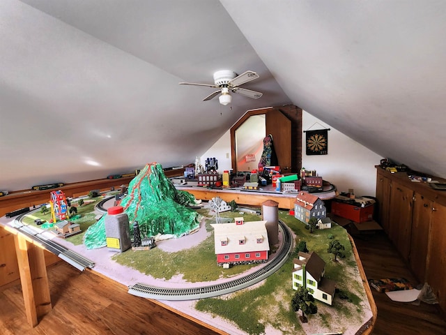 recreation room with hardwood / wood-style flooring and vaulted ceiling