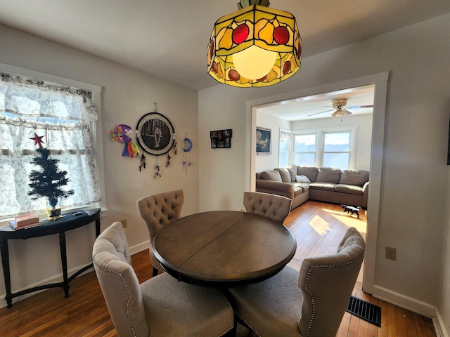 dining space featuring hardwood / wood-style flooring and ceiling fan