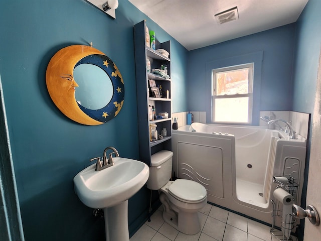 bathroom featuring tile patterned flooring and toilet