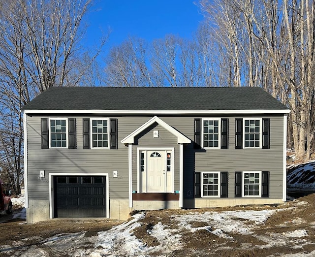 bi-level home featuring a garage