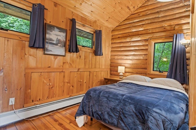 bedroom featuring vaulted ceiling, a baseboard radiator, log walls, hardwood / wood-style flooring, and wood ceiling