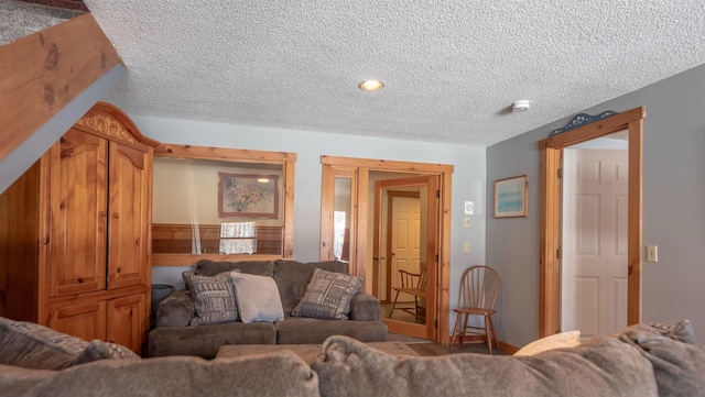 living room featuring a textured ceiling