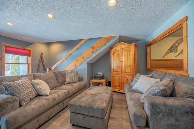 living room featuring hardwood / wood-style floors and a textured ceiling