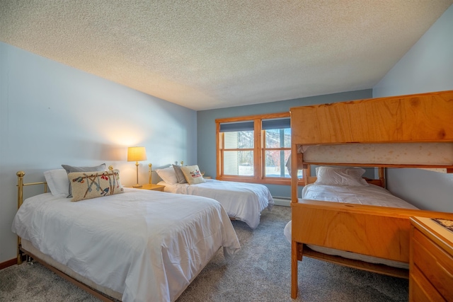 bedroom with a baseboard radiator, carpet flooring, and a textured ceiling