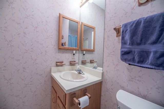 bathroom with vanity and toilet