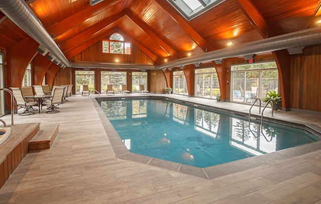 view of swimming pool with a skylight