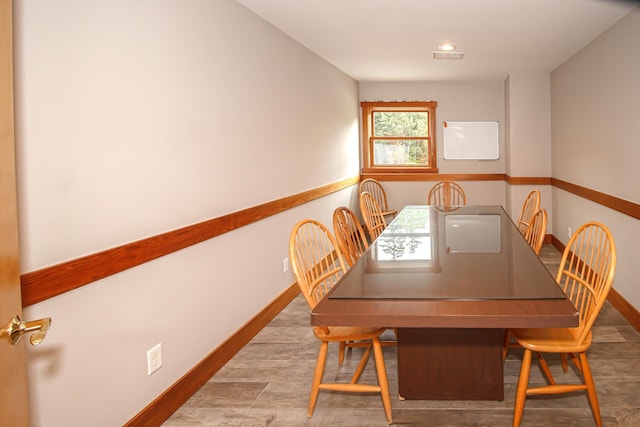 unfurnished dining area featuring hardwood / wood-style floors