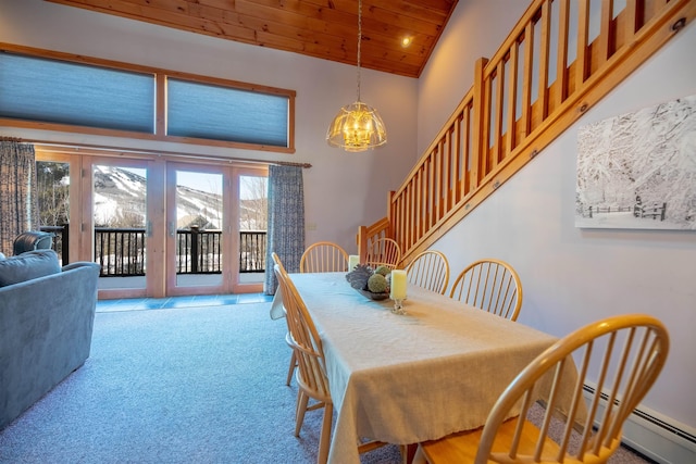 carpeted dining space with a notable chandelier, wood ceiling, high vaulted ceiling, and a baseboard heating unit