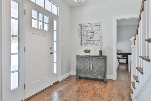 entryway with dark hardwood / wood-style floors