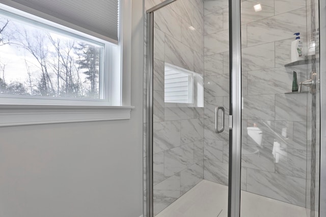 bathroom featuring an enclosed shower