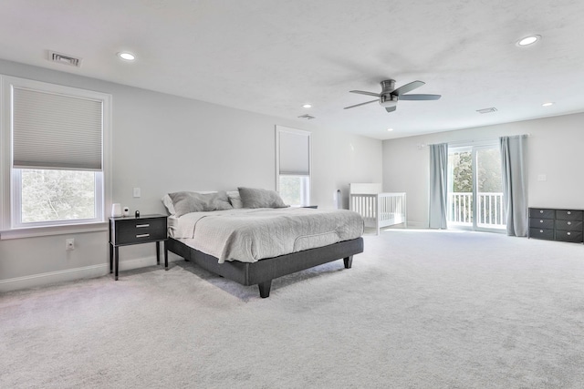 bedroom with light carpet, access to exterior, and ceiling fan