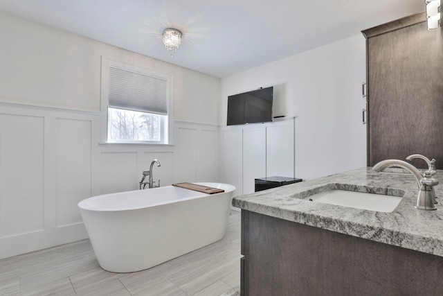 bathroom featuring vanity and a bathing tub