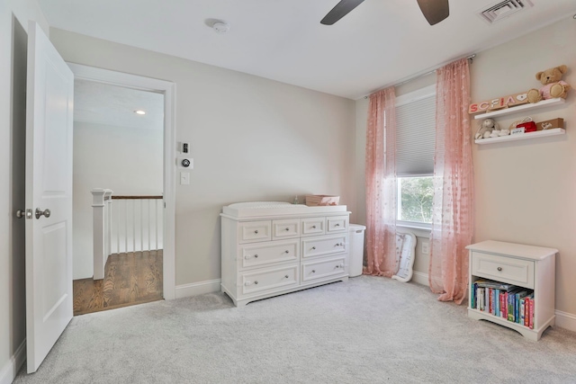 carpeted bedroom with ceiling fan