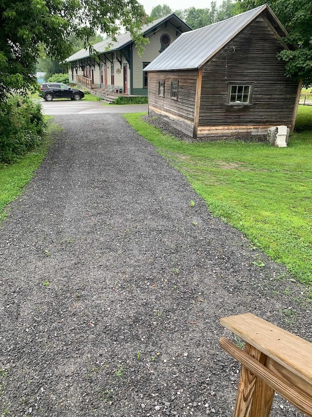 view of side of property with a lawn