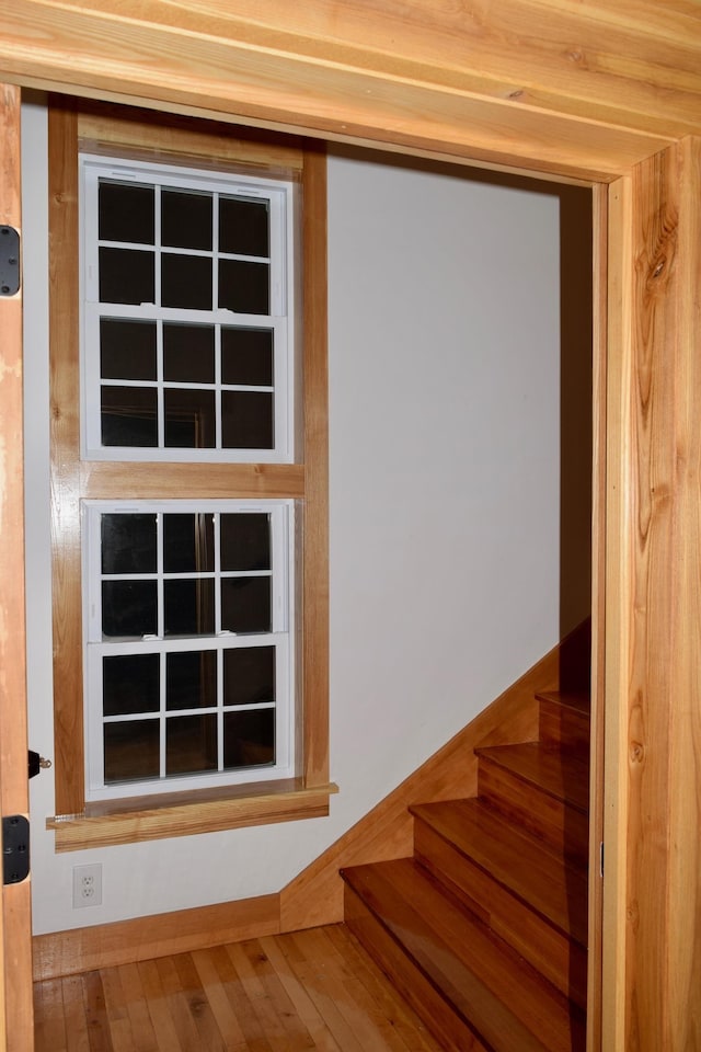 stairs featuring wood-type flooring