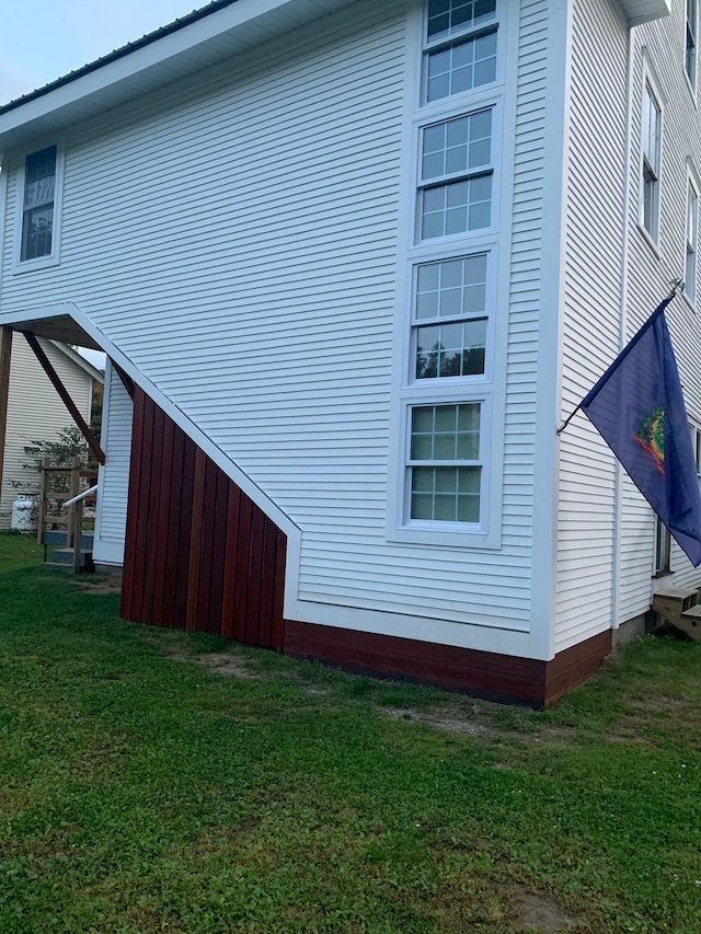 view of property exterior featuring a yard