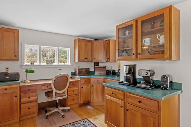 office with light hardwood / wood-style flooring