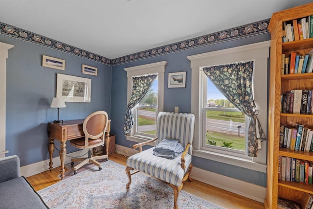 sitting room featuring light hardwood / wood-style floors