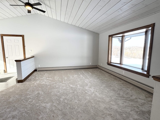 carpeted empty room featuring wood ceiling, a baseboard radiator, and vaulted ceiling