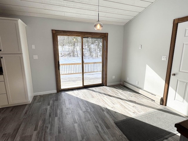 unfurnished dining area with a baseboard radiator and dark hardwood / wood-style floors