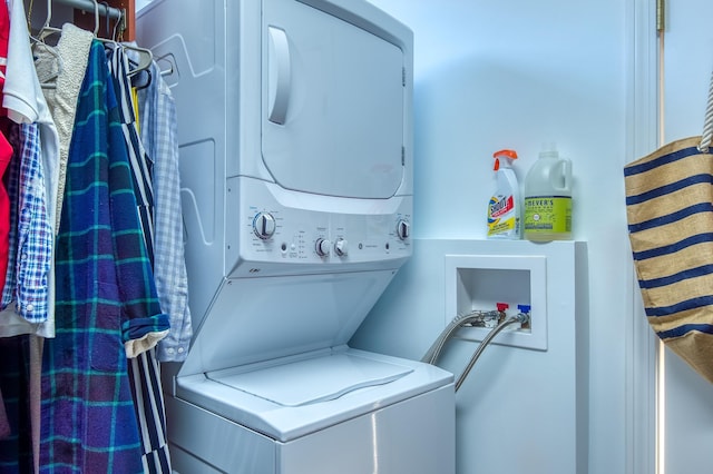 washroom with stacked washer and dryer