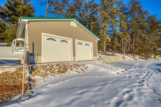 view of snow covered garage