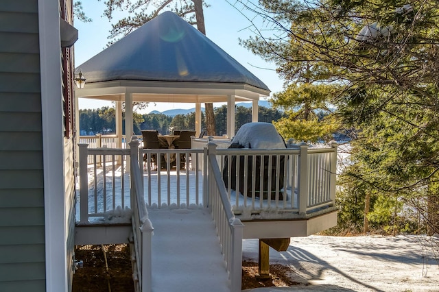 deck with a gazebo and a mountain view