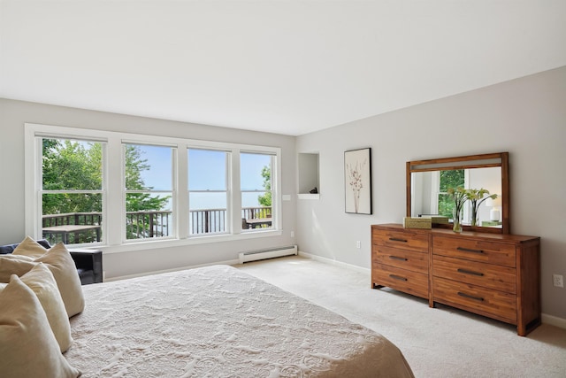 carpeted bedroom with baseboard heating