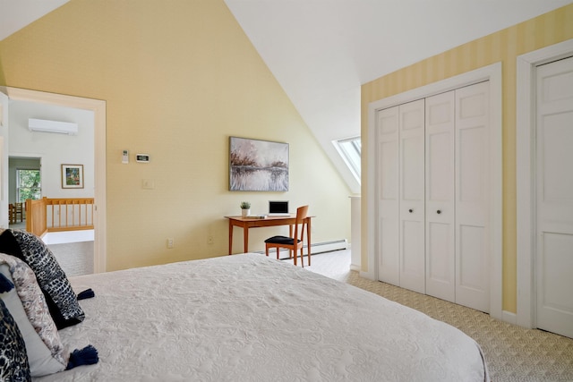 bedroom with a wall mounted air conditioner, lofted ceiling with skylight, a closet, and carpet flooring