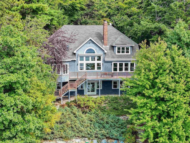 back of property featuring a wooden deck