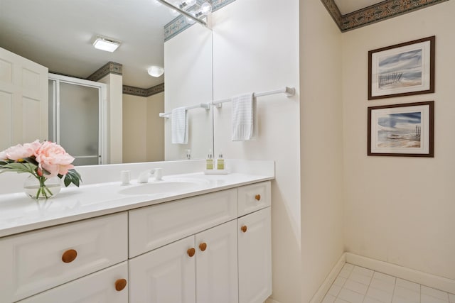 bathroom featuring vanity, tile patterned floors, and walk in shower