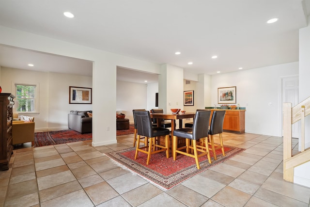 dining space with light tile patterned floors