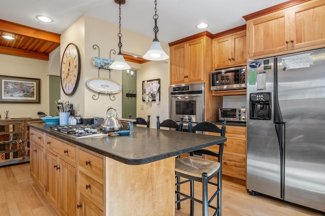 kitchen with appliances with stainless steel finishes, decorative light fixtures, a kitchen breakfast bar, wooden ceiling, and light hardwood / wood-style flooring