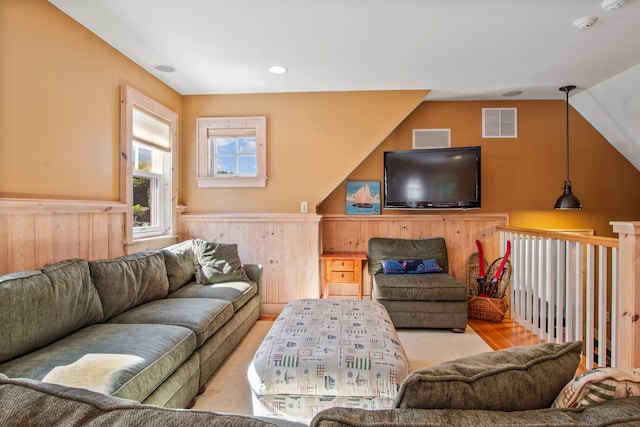 living room featuring vaulted ceiling