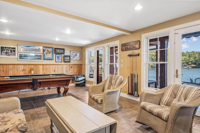 playroom with beam ceiling, pool table, a wealth of natural light, and french doors