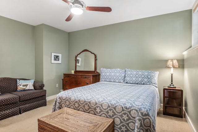 bedroom featuring light carpet and ceiling fan