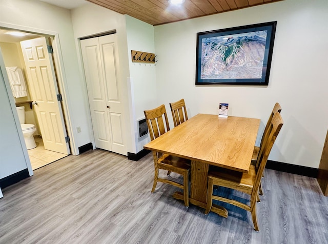 dining space featuring wooden ceiling and light hardwood / wood-style floors