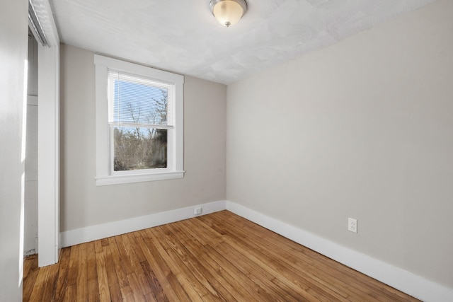 empty room featuring hardwood / wood-style flooring