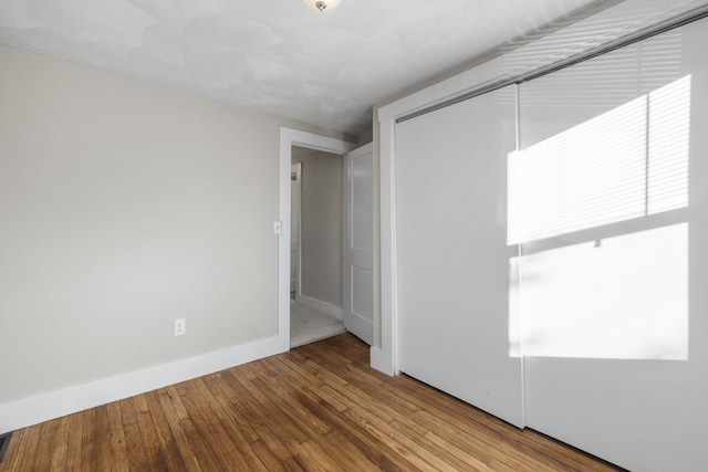 empty room featuring hardwood / wood-style flooring