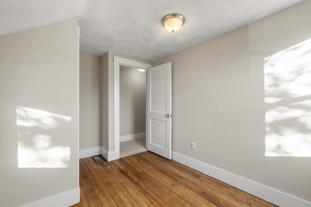 unfurnished bedroom featuring wood-type flooring