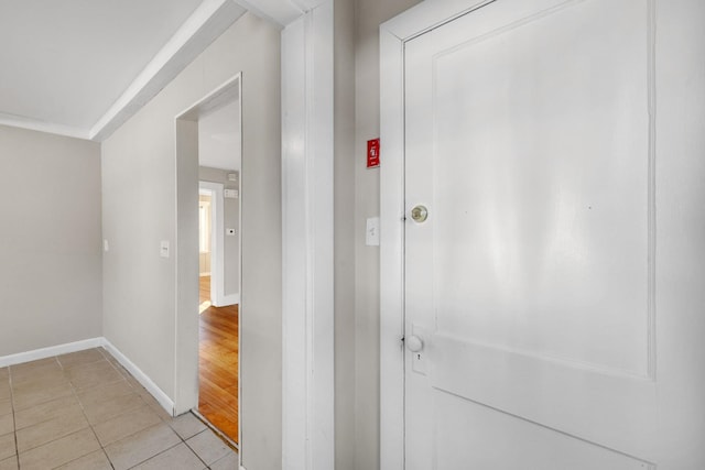 hall featuring light tile patterned floors