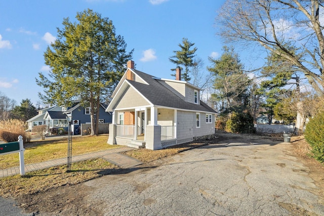 view of property exterior with a porch