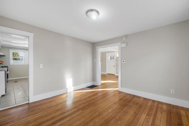 unfurnished room with light hardwood / wood-style floors