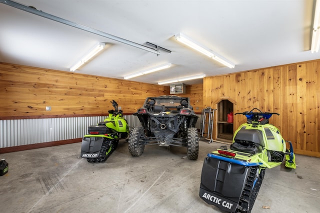 garage featuring wood walls