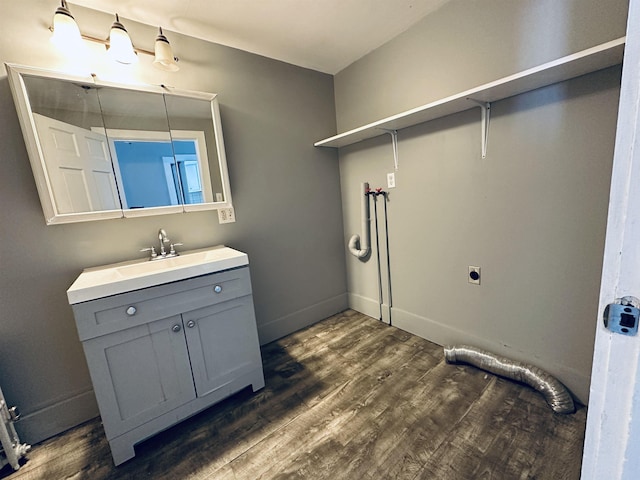 bathroom featuring wood-type flooring and vanity