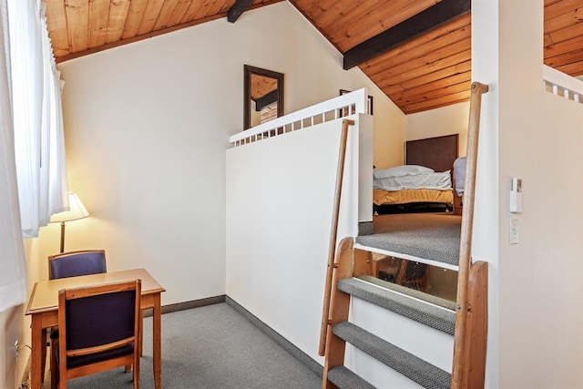 stairs with vaulted ceiling with beams, carpet floors, and wooden ceiling