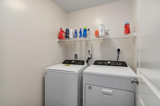 laundry room featuring separate washer and dryer