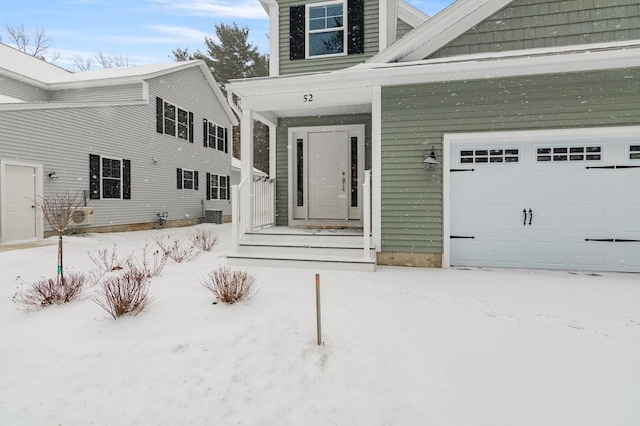 view of snow covered property entrance