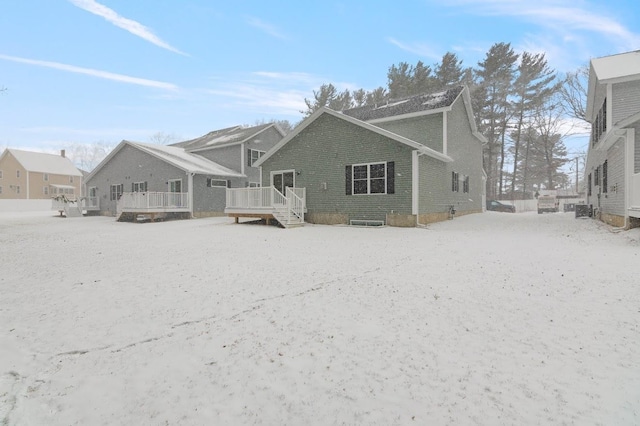 rear view of property with a wooden deck